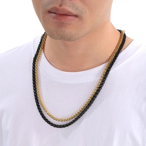 6mm gold and black stainless steel wheat chains on male model in hip hop style