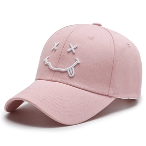 Pink baseball cap featuring a white embroidered smile face with curved brim and top vents