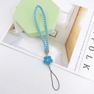 Detail of blue woven leather phone strap with camellia pendant and crystal inlay