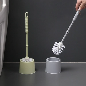 Modern toilet brush set with holder in green and grey colors for bathroom cleaning
