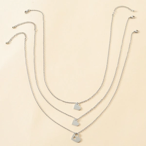 Three-piece silver stainless steel layered heart necklaces with delicate chain detail