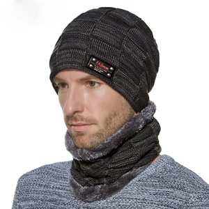 Detail of knit beanie and neck warmer set with fleece lining and fashion leather label