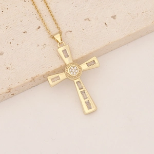 Detailed macro view of 18K gold plated cross pendant with micro-inlaid cubic zirconia