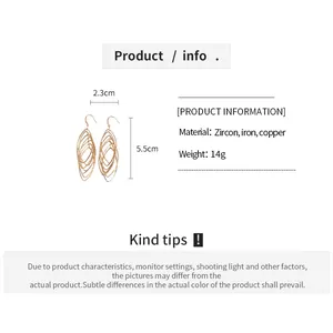 Size chart for golden geometric earrings showing height 5.5cm and material details