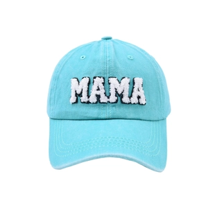 Close-up of Mama plush embroidery on light blue washed cotton baseball cap texture