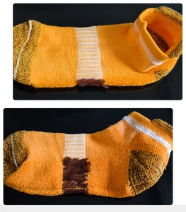 Detail of color-block ankle socks featuring a thick cushioned towel sole for sports
