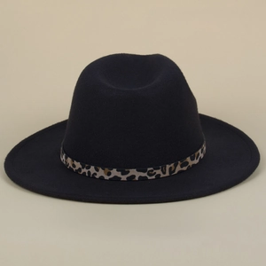 Close-up of a black wool fedora featuring a leopard print belt buckle band decoration