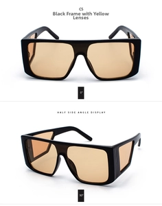 Detail view of oversized retro sunglasses featuring a black frame and yellow lenses