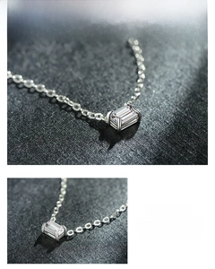 Macro detail of S925 silver necklace with emerald cut cubic zirconia pendant