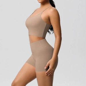 Detail of high-waist yoga shorts and strappy top set in soft brushed khaki fabric