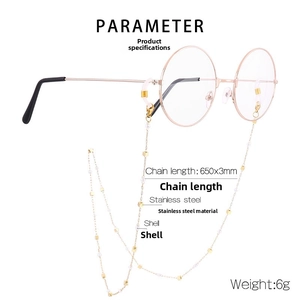 Detail showing rose gold glasses chain with square beads and white shell pearls