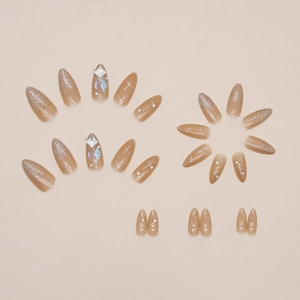 Sparkling almond press-on nails with Aurora crystals and silver glitter in nude pink