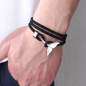 Nautical braided rope bracelet with silver whale tail charm in multi-layer wrap style