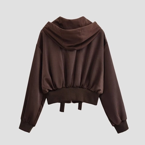 Back view of a casual chocolate brown cropped hoodie with ribbed hem and high-quality fabric