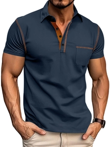 Detail view of navy blue polo shirt featuring brown contrast stitching and chest pocket