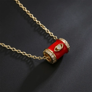 Luxurious 18K gold plated necklace featuring a red enamel cylinder evil eye pendant