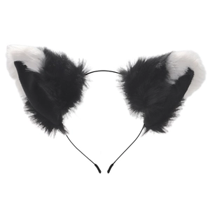 Close-up of black and white plush cat ears headband with soft faux fur texture