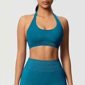 Vue de face d'un soutien-gorge de sport dos nu et d'un legging taille haute bleu paon
