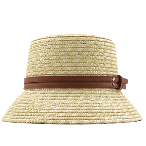 French vintage straw bucket hat for women with brown leather band and brass rivets detail
