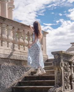 Detail view of the elegant blue floral print one-piece swimsuit and matching skirt