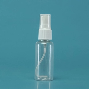 Close-up of a clear plastic spray bottle with a white fine mist pump and transparent cap