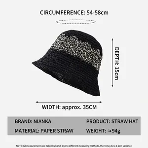 Women's black hand-woven straw bucket hat with dimensions and material specifications