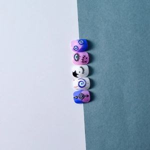 Detail of 5D blue evil eye embossed nail stickers with hand-painted Halloween style art