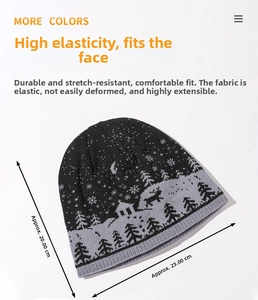 Detail of grey winter knit beanie with reindeer and snowflake jacquard pattern and ribbed hem