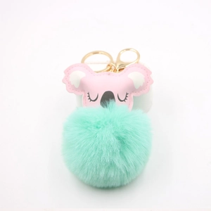 Cute koala plush ball keychain with pink faux leather face and mint green fluffy pompom