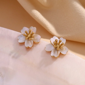 Macro shot of 18K gold-plated stainless steel cherry blossom studs with natural mother of pearl