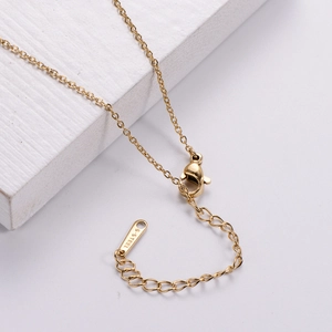 Minimalist gold stainless steel necklace with adjustable chain and S-STEEL engraved tag