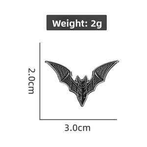 Detail showing a black alloy bat brooch with 3.0cm width and 2g weight for Halloween