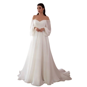 Elegant white off-shoulder wedding dress with lantern sleeves and a flowing A-line train