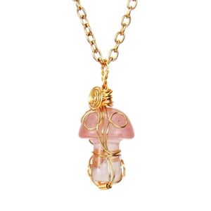 Detailed view of handmade gold wire wrapped pink crystal mushroom pendant necklace