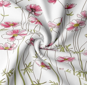 Detailed view of floral tapestry fabric texture showing pink cosmos prints and soft draping