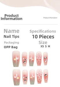 Detail view of pink gradient press-on nails with 3D tulip flowers and sparkling rhinestones