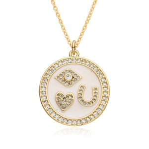 Gold necklace featuring a round evil eye and heart lucky pendant with zircon stones