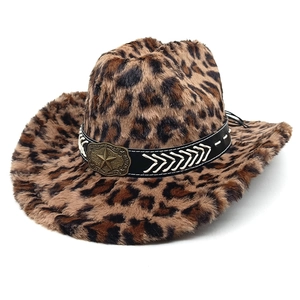 Detailed macro view of plush leopard print cowboy hat with bronze star buckle and stitching