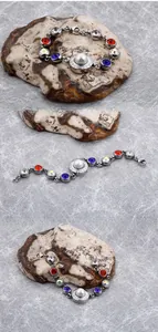 Detailed macro view of crystal bracelet with multicolored gemstones and center pearl