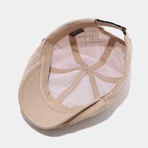 Detail view of cotton newsboy cap interior featuring breathable lining and sweatband