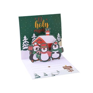Christmas 3D pop-up greeting card with cute penguins and house design for holiday wishes.