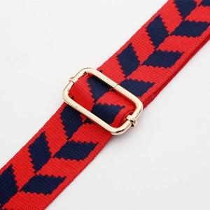 Adjustable jacquard bag strap with red leaf pattern and gold metal buckle detail