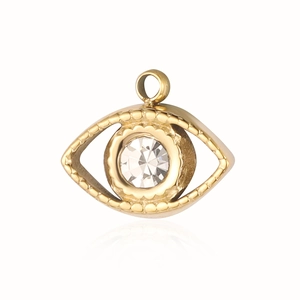 Close-up of golden evil eye charm with clear crystal stone and rippled metal frame