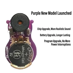 Internal electronic module of cricket noisemaker showing CR2032 battery and purple casing