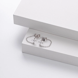 Detail of S925 sterling silver flower stud earrings with hanging chain and zircon stones