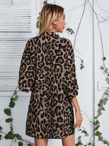 Women's leopard print shawl cardigan with long sleeves and lapel collar in a relaxed fit