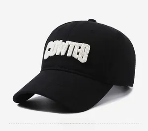 Detail of 3D white POWTER letter embroidery on a premium black cotton baseball cap