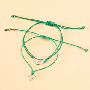 Detailed view of handmade green woven bracelets with silver dinosaur and heart charms