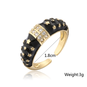 Detailed view of bohemian gold star ring with black enamel showing 1.8cm diameter