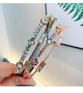 Macro detail of hand-held double-layer headbands with luxury inlaid crystals and zircons